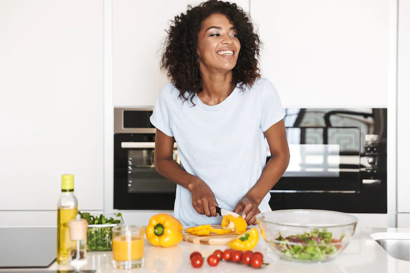 Women cutting vegetables