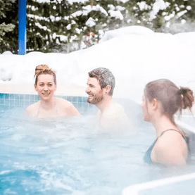 Family in the hot bath tub