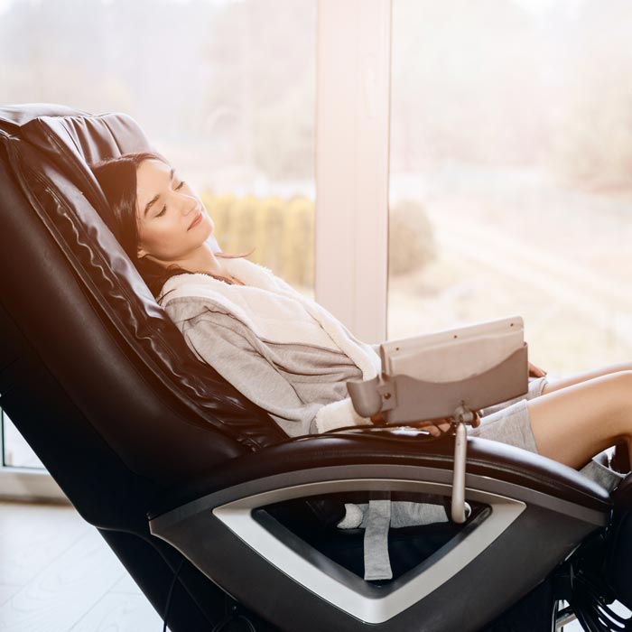 woman relaxing in massage chair