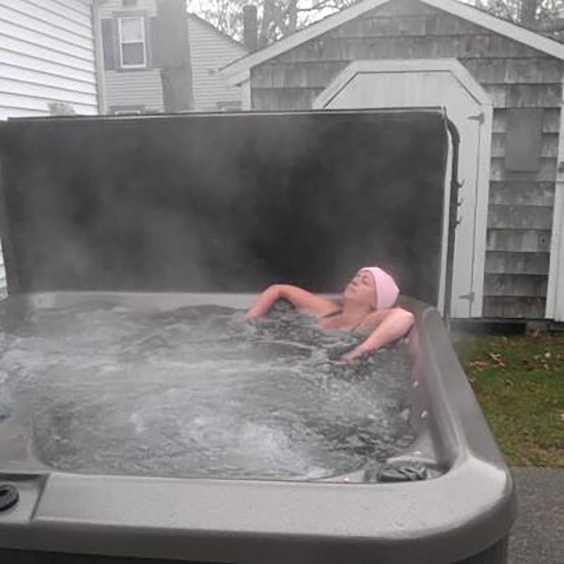 woman relaxing in hot tub